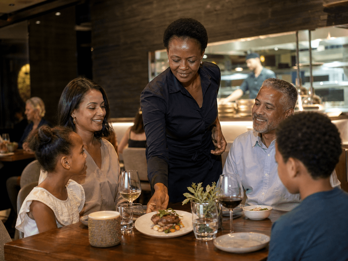 Waiter serving customers in a busy restaurant